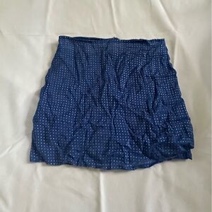 The skirt has gold little stars on it. Size small great quality,
